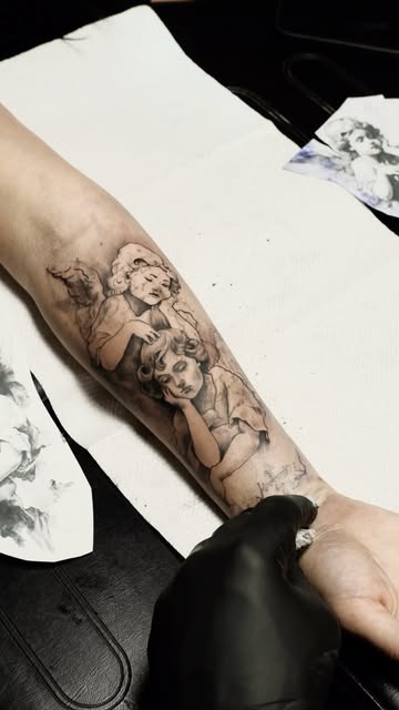 Detailed portrait composition tattoo on a forearm